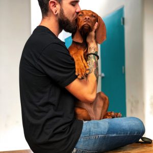 photo-of-man-kissing-his-dog-2745151
